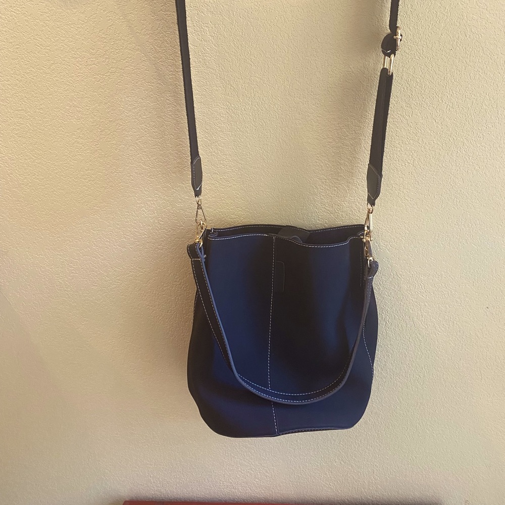 Crossbody Bucket Bag. Never used. Roomy and sturdy.